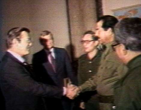 Donald Rumsfeld shaking hands with Saddam Hussein